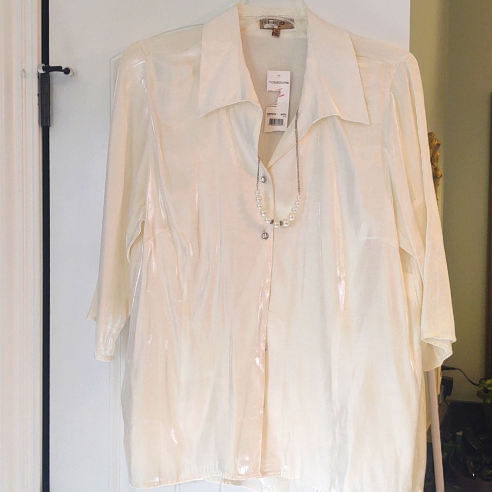 Beautiful shiny cream dress shirt with attached pearl necklace.